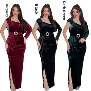 Detail of slim velvet evening gowns in wine red, black, and dark green with tassel sleeves