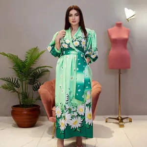 Elegant green floral maxi dress with white daisy prints and stylish puff sleeves