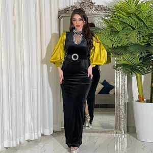 Black velvet slim-fit evening gown with contrasting yellow satin lantern sleeves