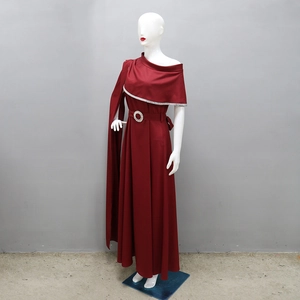 Close-up of elegant burgundy one-shoulder gown with cape sleeve and rhinestone belt buckle