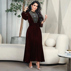 Elegant deep burgundy velvet jalabia with intricate blue and gold beaded embroidery details