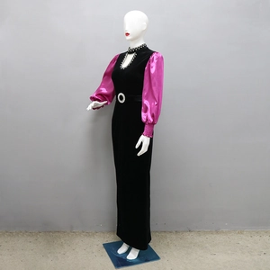Detail of velvet dress with magenta satin lantern sleeves and rhinestone waist buckle