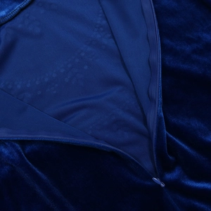 Detail of the high-quality velvet fabric and invisible zipper on the green robe