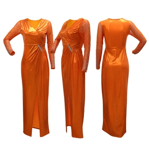 Detail view of orange metallic evening gown with beaded mesh sleeves and waist rhinestones