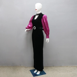 Detailed view of high neck velvet gown with pink satin puff sleeves and rhinestone trim