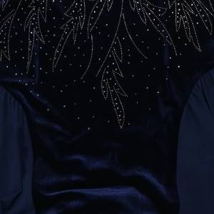 Detailed view of navy velvet fabric and intricate rhinestone feather pattern on Jalabia dress