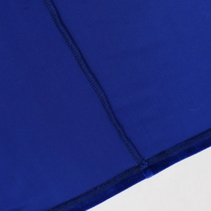 Macro detail of royal blue knit velvet fabric showing stitching and high-quality seams
