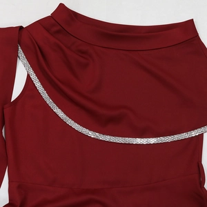 Detail of burgundy evening gown showing pleated neckline with silver rhinestone trim