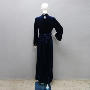 Detail view of navy velvet long dress with sparkling beaded collar and back slit