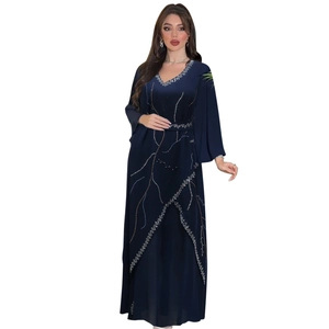 Detail of navy blue Abaya dress with rhinestone wave embroidery and elegant V-neck design