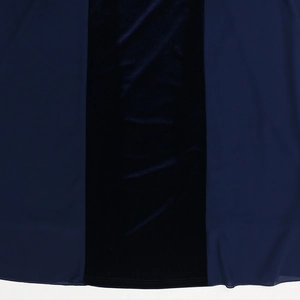 Close-up detail of navy blue chiffon and velvet patchwork fabric with stitching detail