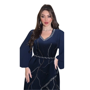 Detail of dark blue V-neck dress featuring silver rhinestone wavy patterns and slim waist