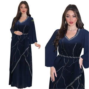Detailed close-up of beaded wave patterns and rhinestones on the navy chiffon kaftan dress