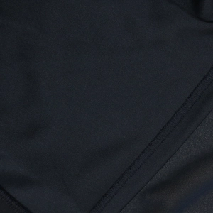 Close-up of high-quality stitching and texture on a black chiffon jalabia evening gown