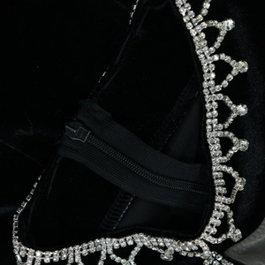 Macro detail of velvet dress with crystal trim edges and premium nylon zipper closure
