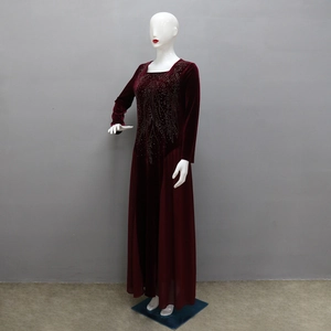 Detailed view of the square neck and intricate leaf rhinestone patterns on velvet dress