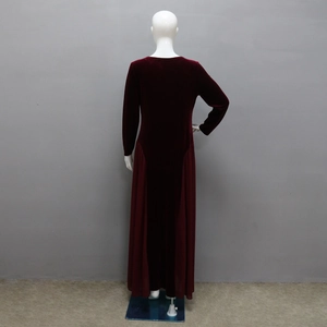 Detail of burgundy velvet dress featuring chiffon patchwork and elegant slim fit cut
