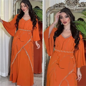Elegant orange chiffon maxi dress with silver rhinestone leaf patterns and flare sleeves