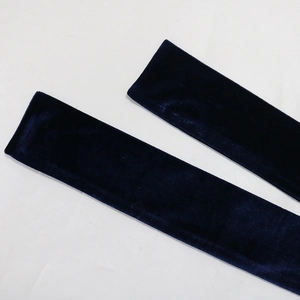 Detail shot of navy blue velvet fabric texture showing soft material for party dress