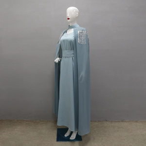 Detailed silver fringe and bead embroidery on blue-grey long sleeve formal dress