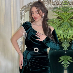 Elegant dark green velvet evening gown with metal fringe and rhinestone buckle belt