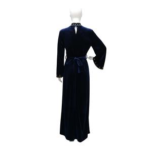 Detail of beaded cuffs and velvet fabric texture on the back of this blue Abaya dress