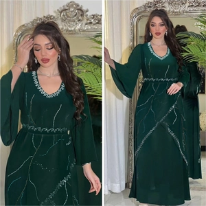 Detail of V-neck dark green chiffon robe with rhinestones and flared sleeves
