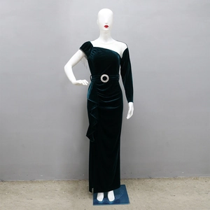 Detail of emerald green velvet dress with asymmetric fringe shoulder and beaded belt