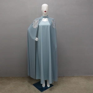 Detail of blue-grey gown with silver sequins and metallic tassels on detachable cape