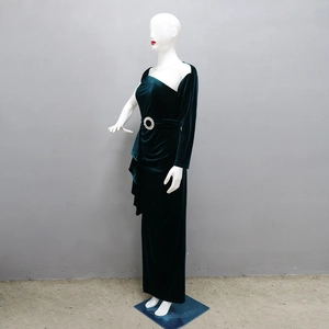 Close-up of velvet evening dress with shoulder chain fringe and rhinestone belt buckle