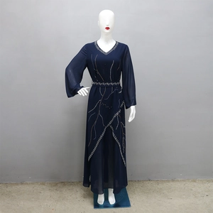 Detailed view of dark blue chiffon maxi dress with golden beadwork and sequins