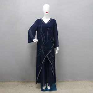 Detail of elegant dark blue chiffon dress featuring sparkling rhinestones and V-neckline