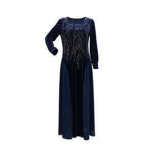 Detail of blue velvet Jalabia dress with sparkling rhinestone feather patterns and chiffon hem