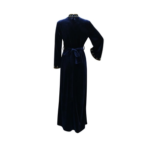 Detail of navy blue velvet evening gown showing exquisite turquoise and gold bead embroidery