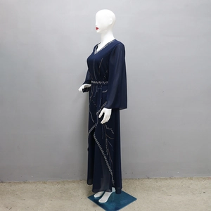Detail of navy blue chiffon abaya featuring intricate silver rhinestone patterns on sleeves