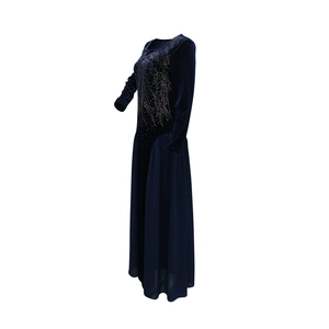 Detail of navy velvet jalabiya with shimmering silver sequins and chiffon skirt