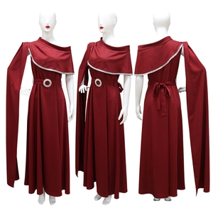 Detail of red one-shoulder evening gown with cape sleeve and silver rhinestone neckline