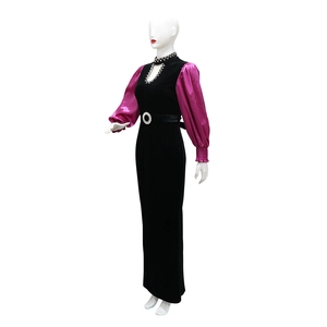 Detail of velvet dress with fuchsia satin sleeves and sparkling rhinestone neckline