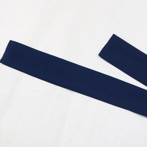 Detailed close-up of dark blue woven fabric belt with clean stitching and fine texture