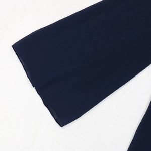 Detail of navy blue chiffon fabric showing the lightweight texture and wide sleeve hem