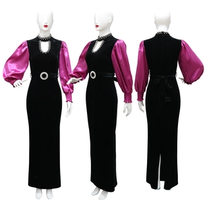 Detail view showing velvet fabric texture and crystal waistband on the slim evening gown