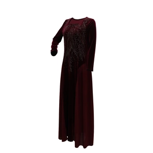 Detail of burgundy velvet dress with sparkling silver rhinestones and chiffon fabric