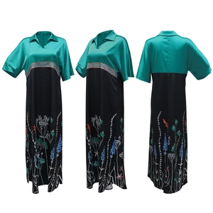 Detail of teal satin bodice and floral print hem on a stylish contrast maxi dress