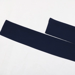 Detail view of deep blue ribbed elastic knit fabric tape for dress belts or headbands