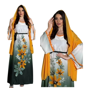 Detailed view of Middle Eastern style gown with floral print and lace hood shawl