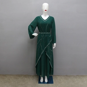 Detail of dark green chiffon robe featuring silver sequin trim and elegant V-neckline