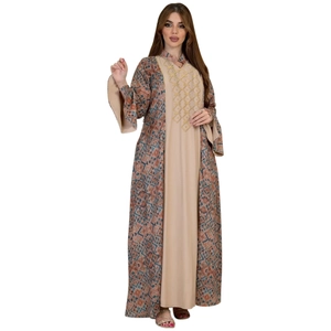 Detail of Middle Eastern two-piece robe with beige inner dress and blue geometric pattern