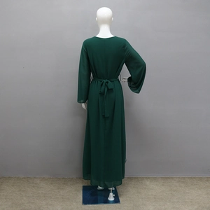 Rear view of dark green chiffon maxi dress showing drape and matching waist belt