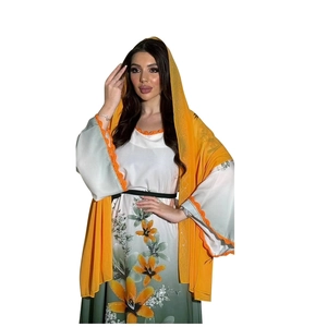Detail of orange lace crochet trim on sleeves and floral print of this long robe dress