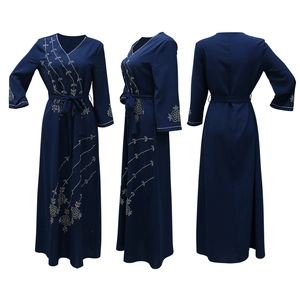 Detailed views of navy blue long dress with crystal flower patterns and V-neck design